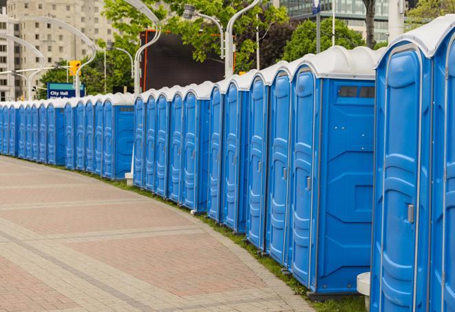 a line of portable restrooms at an outdoor wedding, catering to guests with style and comfort in Delray Beach FL